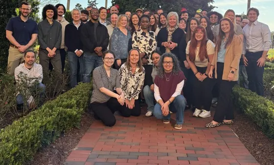 The FlatWorld team gathered together at a company meeting.
